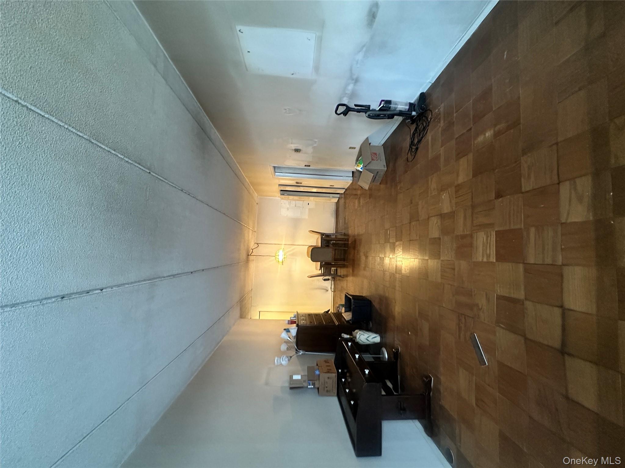 160 Academy Street, Unit L1 Poughkeepsie, NY 12601 - Photo 5 of 16 a room with gym equipment and a view of living room