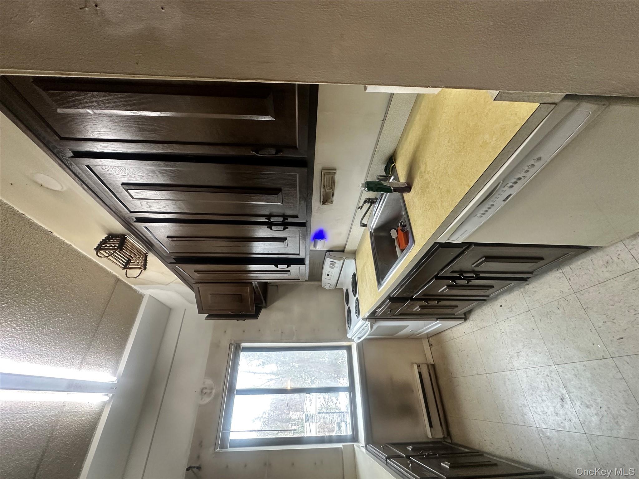 160 Academy Street, Unit L1 Poughkeepsie, NY 12601 - Photo 7 of 16 a kitchen with a sink stove top oven and cabinets