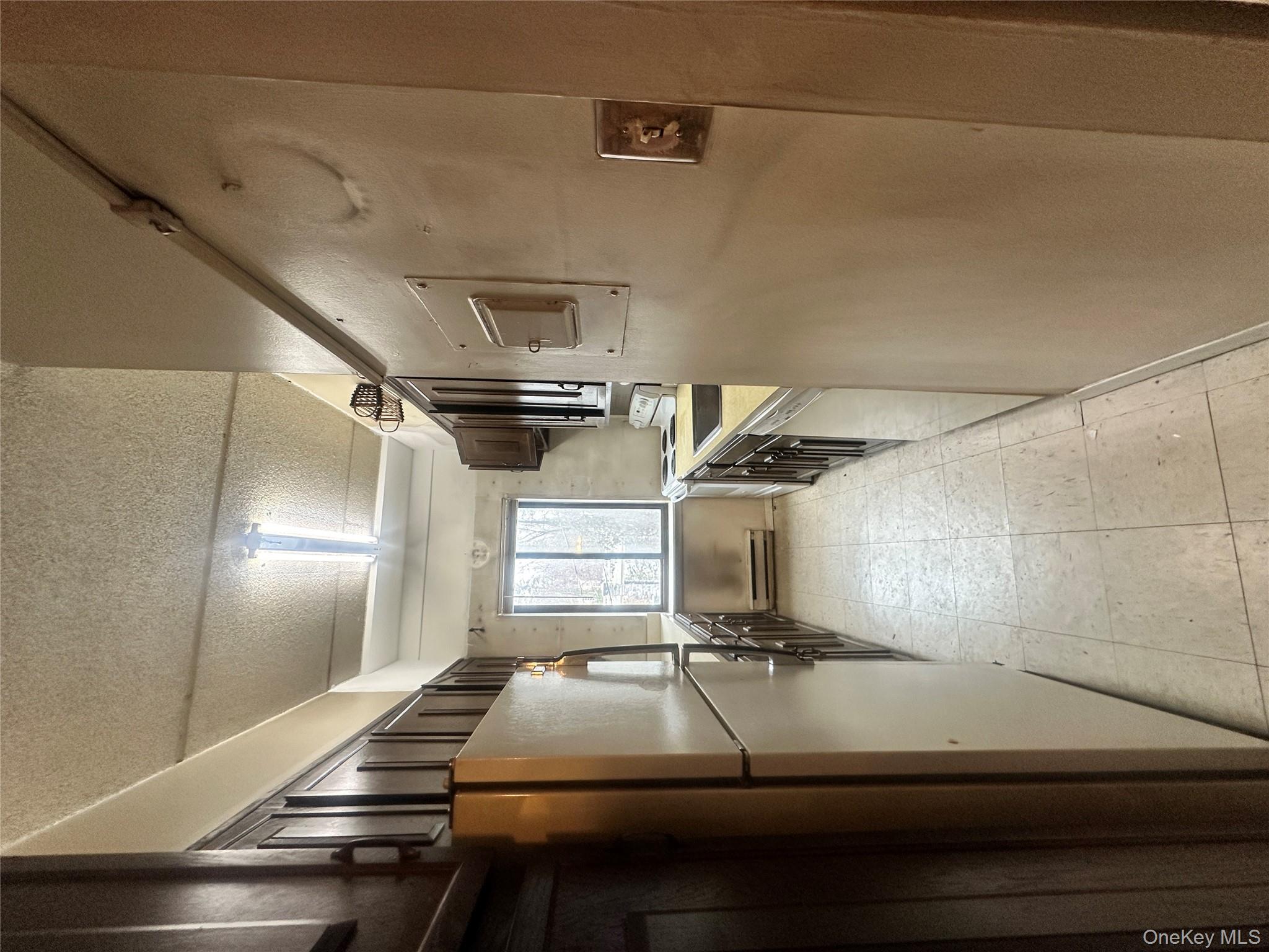 160 Academy Street, Unit L1 Poughkeepsie, NY 12601 - Photo 9 of 16 a view of a hallway with stainless steel appliances