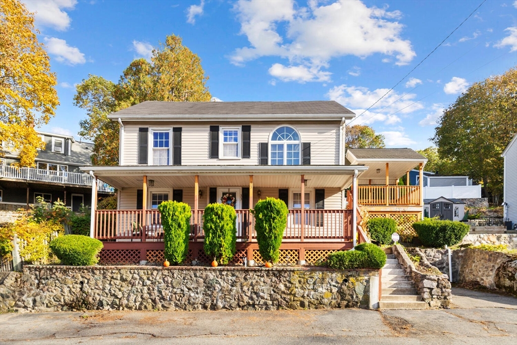 a front view of a house with garden