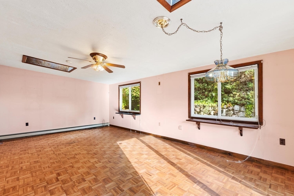 33 Springdale Avenue Saugus, MA 01906 - Photo 16 of 37 a view of a room with a window and a ceiling fan