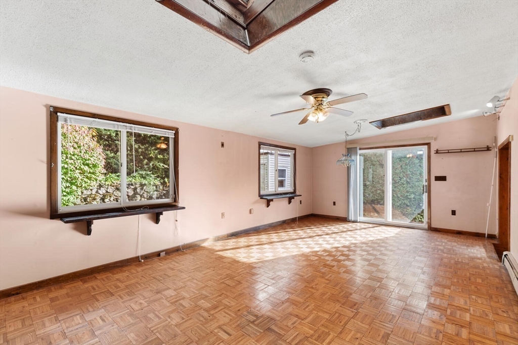 33 Springdale Avenue Saugus, MA 01906 - Photo 17 of 37 a view of a livingroom with a ceiling fan and window