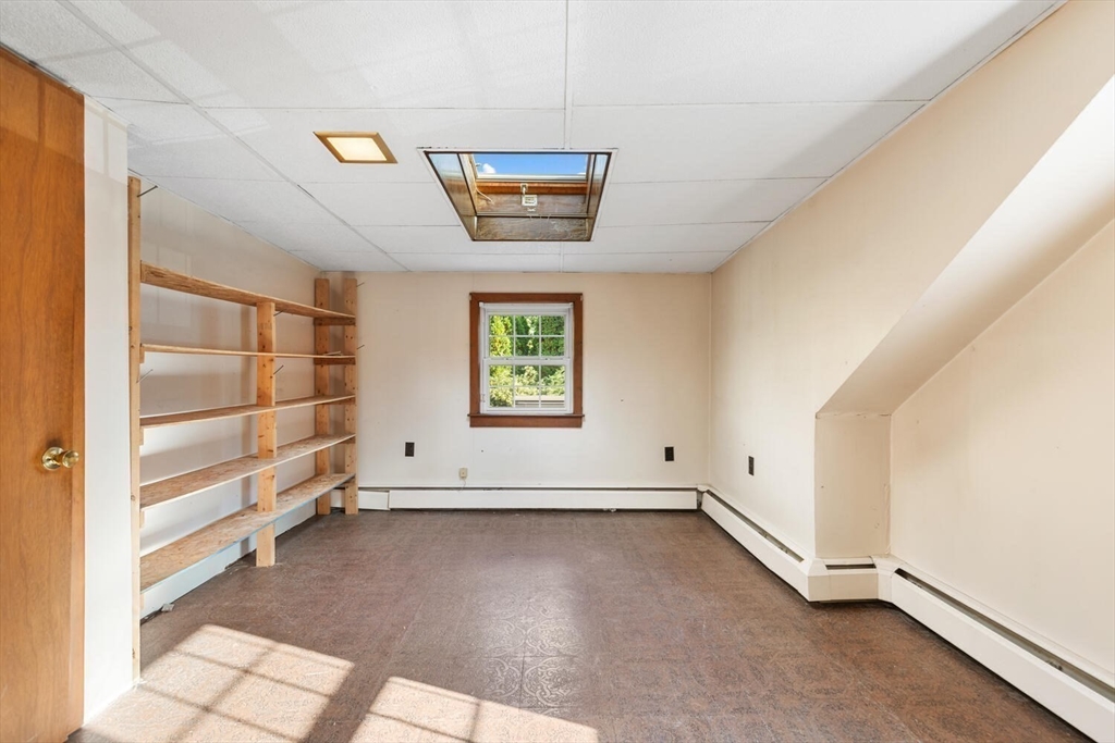 33 Springdale Avenue Saugus, MA 01906 - Photo 23 of 37 an empty room with wooden floor and windows