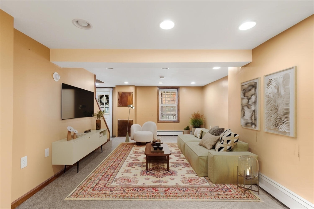 33 Springdale Avenue Saugus, MA 01906 - Photo 28 of 37 a living room with furniture and a flat screen tv