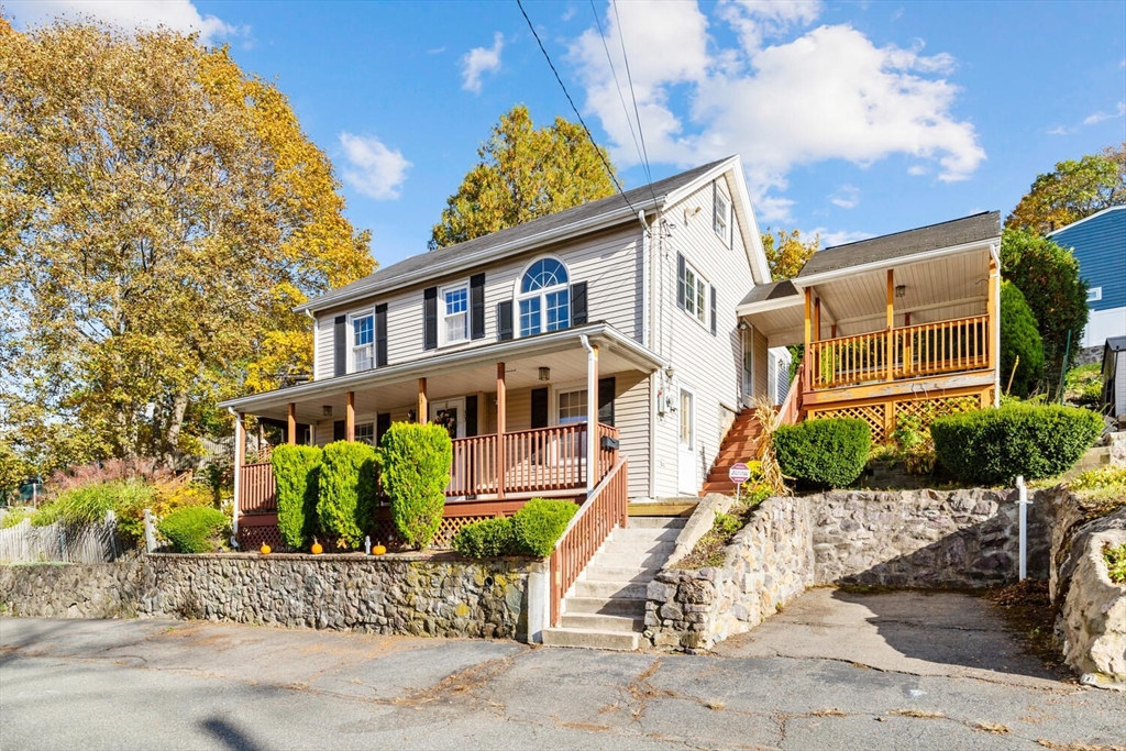 33 Springdale Avenue Saugus, MA 01906 - Photo 3 of 37 a view of a brick house with a yard