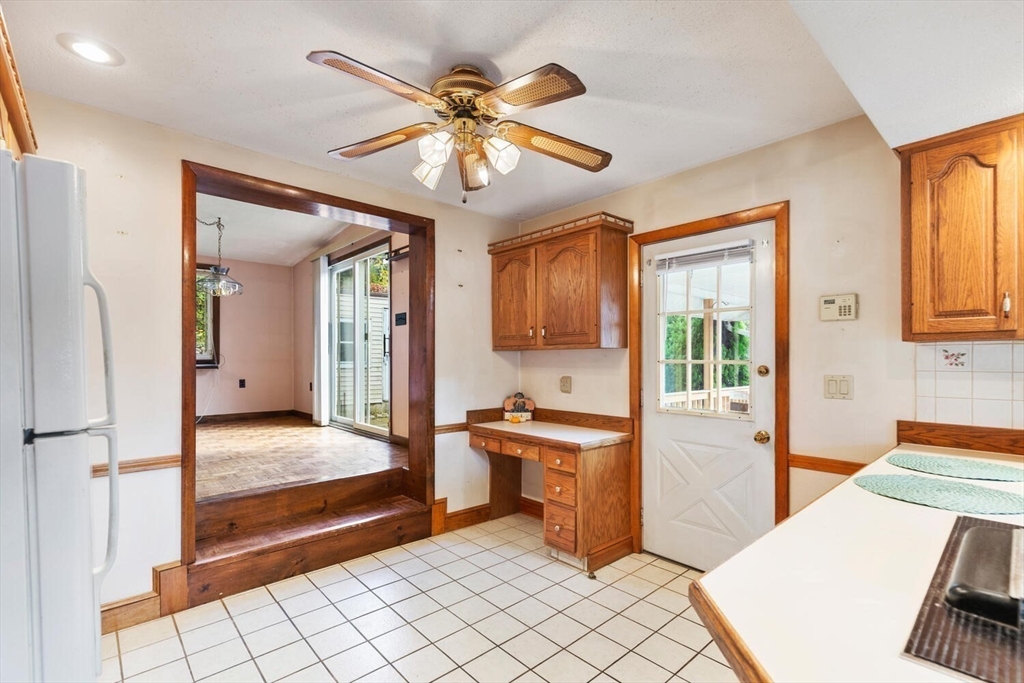 33 Springdale Avenue Saugus, MA 01906 - Photo 8 of 37 a view of a hallway with a livingroom and chandelier