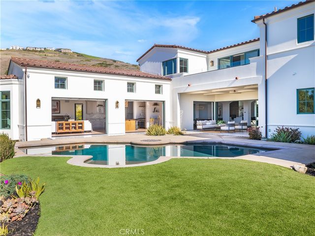 a large white building with a yard