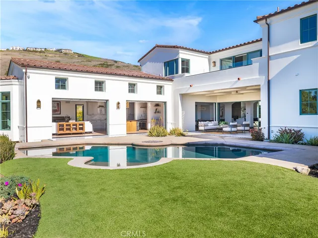 a large white building with a yard