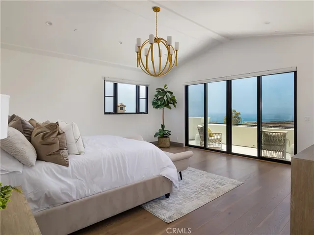 a bedroom with bed and balcony