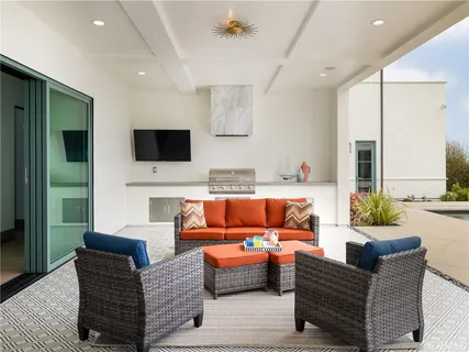 a living room with fireplace furniture and a flat screen tv