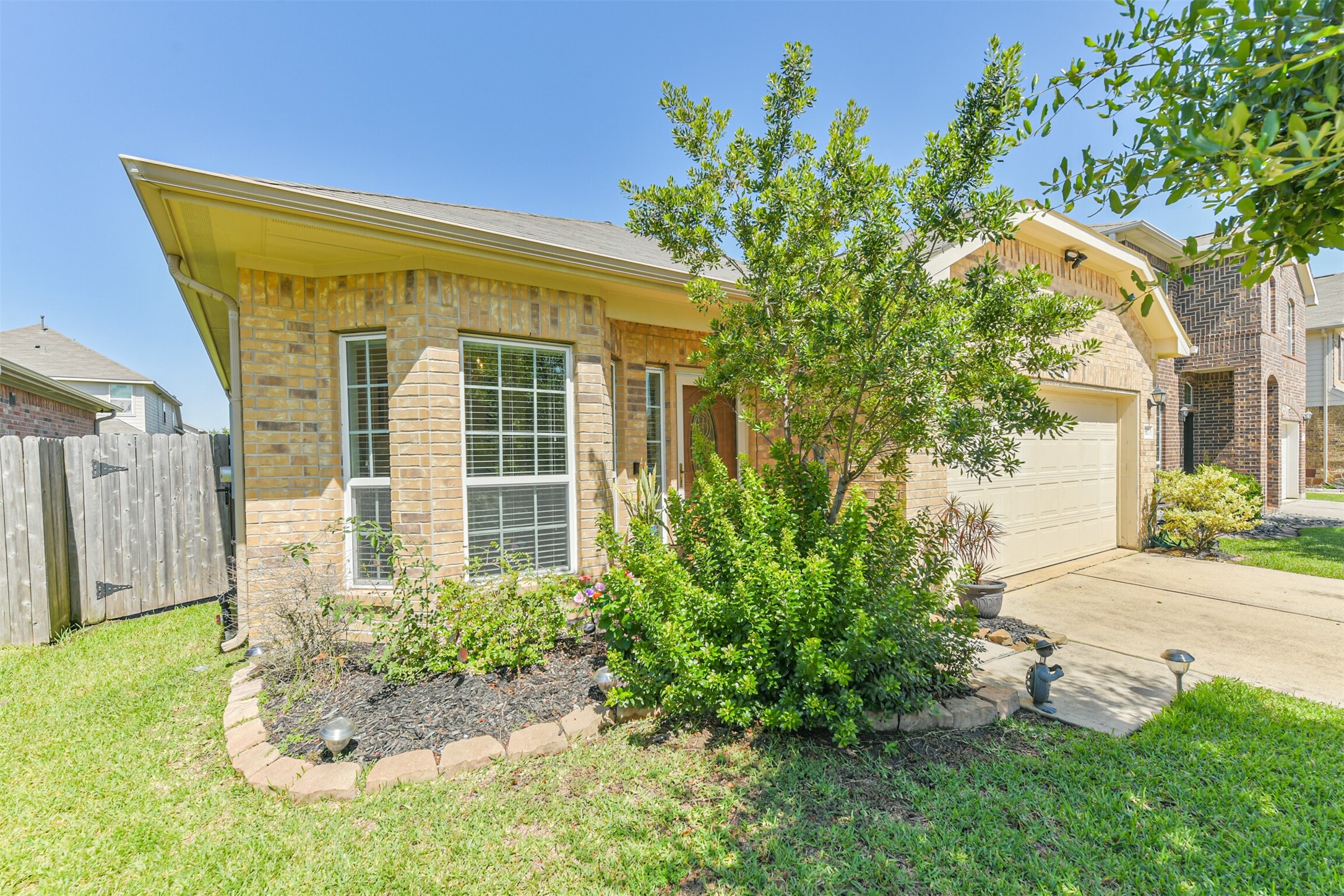 7527 Windsor Valley Lane Houston, TX 77049 - Photo 5 of 35 a front view of a house with a yard