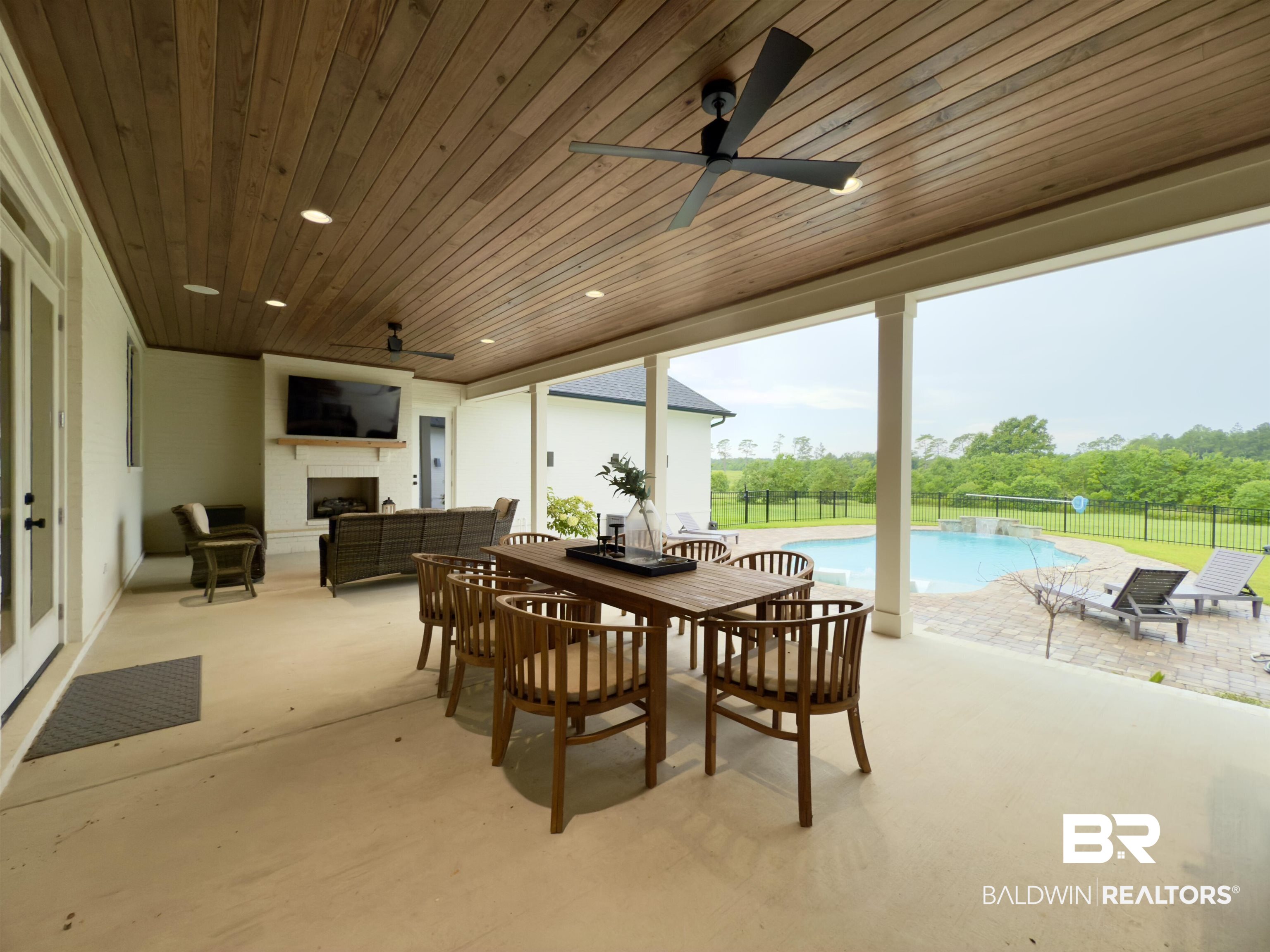 21767 Gallery Boulevard Fairhope, AL 36532 - Photo 57 of 74 View of patio / terrace with an outdoor living space with a fireplace and ceiling fan