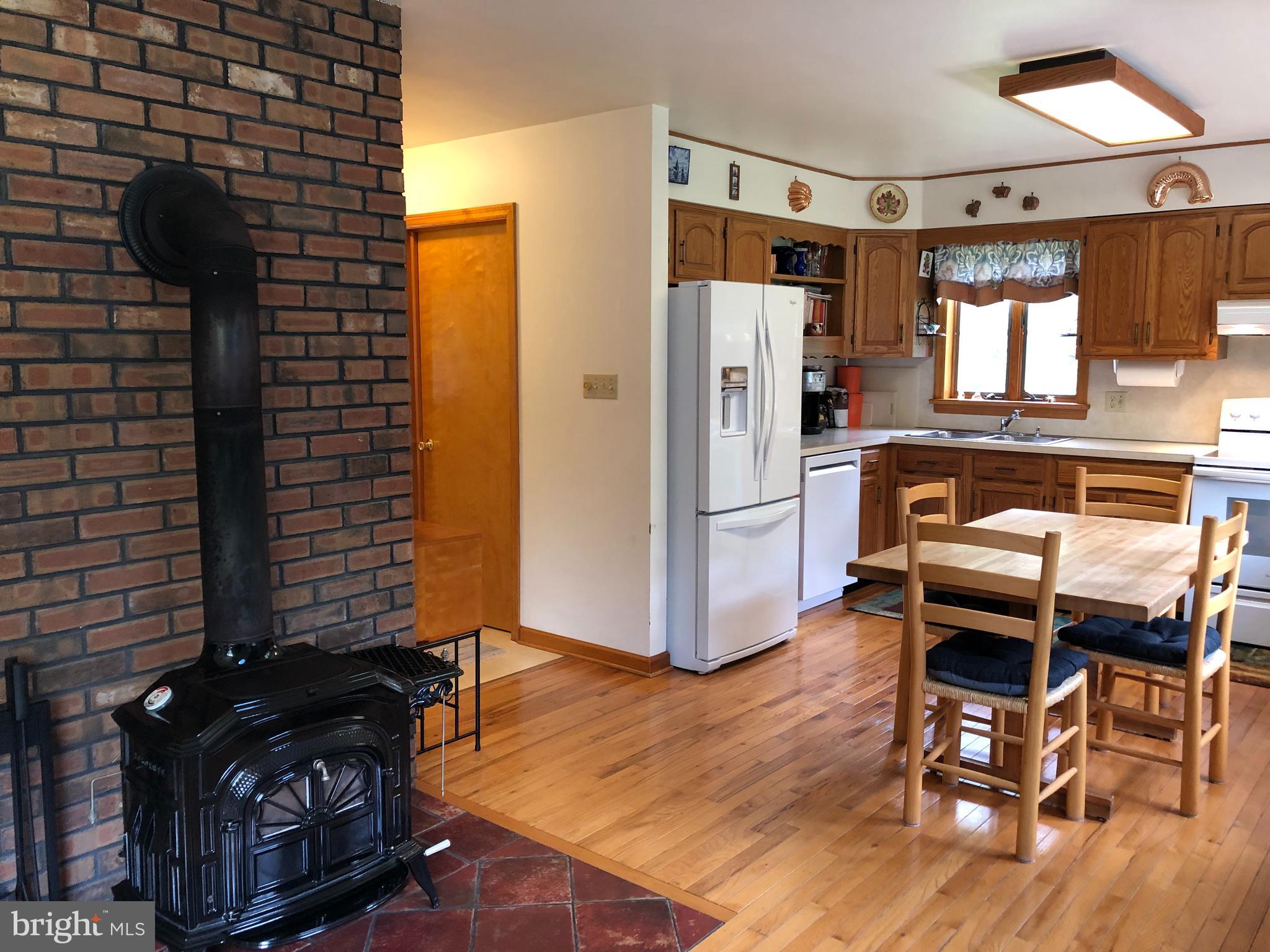 155 Newkirk Station Road Elmer, NJ 08318 - Photo 5 of 21 Kitchen with Wood Stove