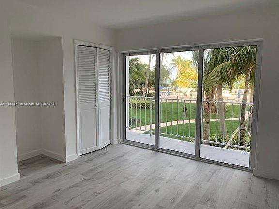 881 Ocean Drive, Unit TH11 Key Biscayne, FL 33149 - Photo 11 of 22 a view of a room with large windows and pool table