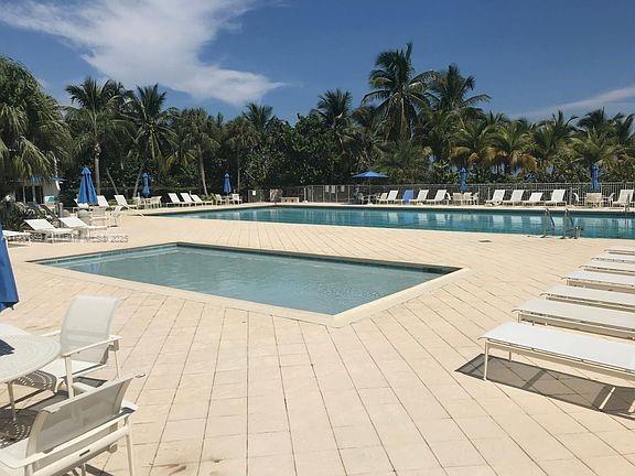 881 Ocean Drive, Unit TH11 Key Biscayne, FL 33149 - Photo 16 of 22 a view of swimming pool and lake view