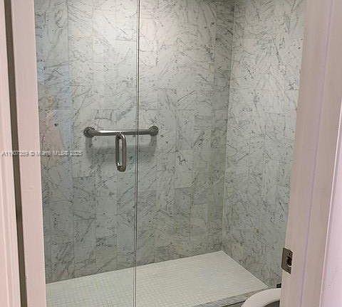 881 Ocean Drive, Unit TH11 Key Biscayne, FL 33149 - Photo 9 of 22 a bathroom with a shower