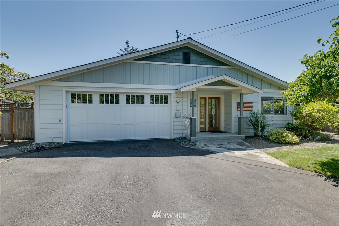 1118 Dyer Road Sultan, WA 98294 - Photo 2 of 40 a front view of a house with a yard and garage