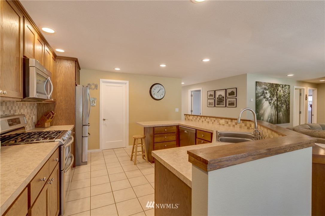 1118 Dyer Road Sultan, WA 98294 - Photo 13 of 40 a kitchen with sink cabinets and stove top oven