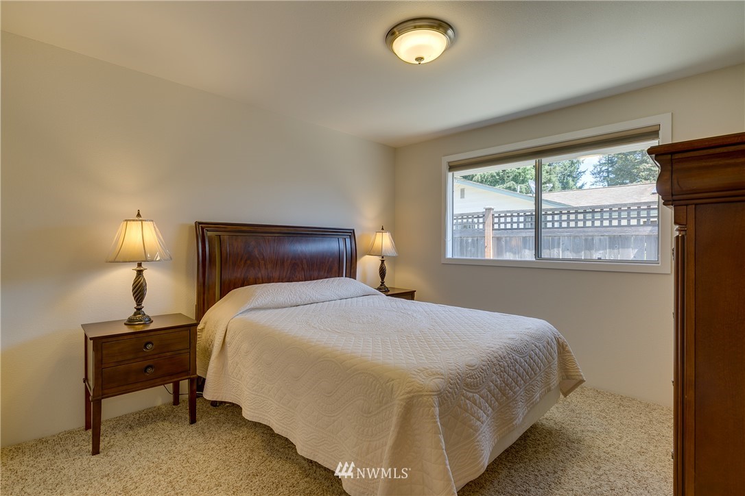 1118 Dyer Road Sultan, WA 98294 - Photo 19 of 40 a bedroom with a bed and a large window