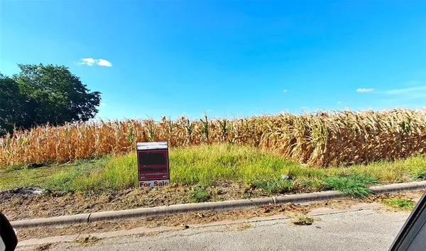 a view of a yard and ocean view
