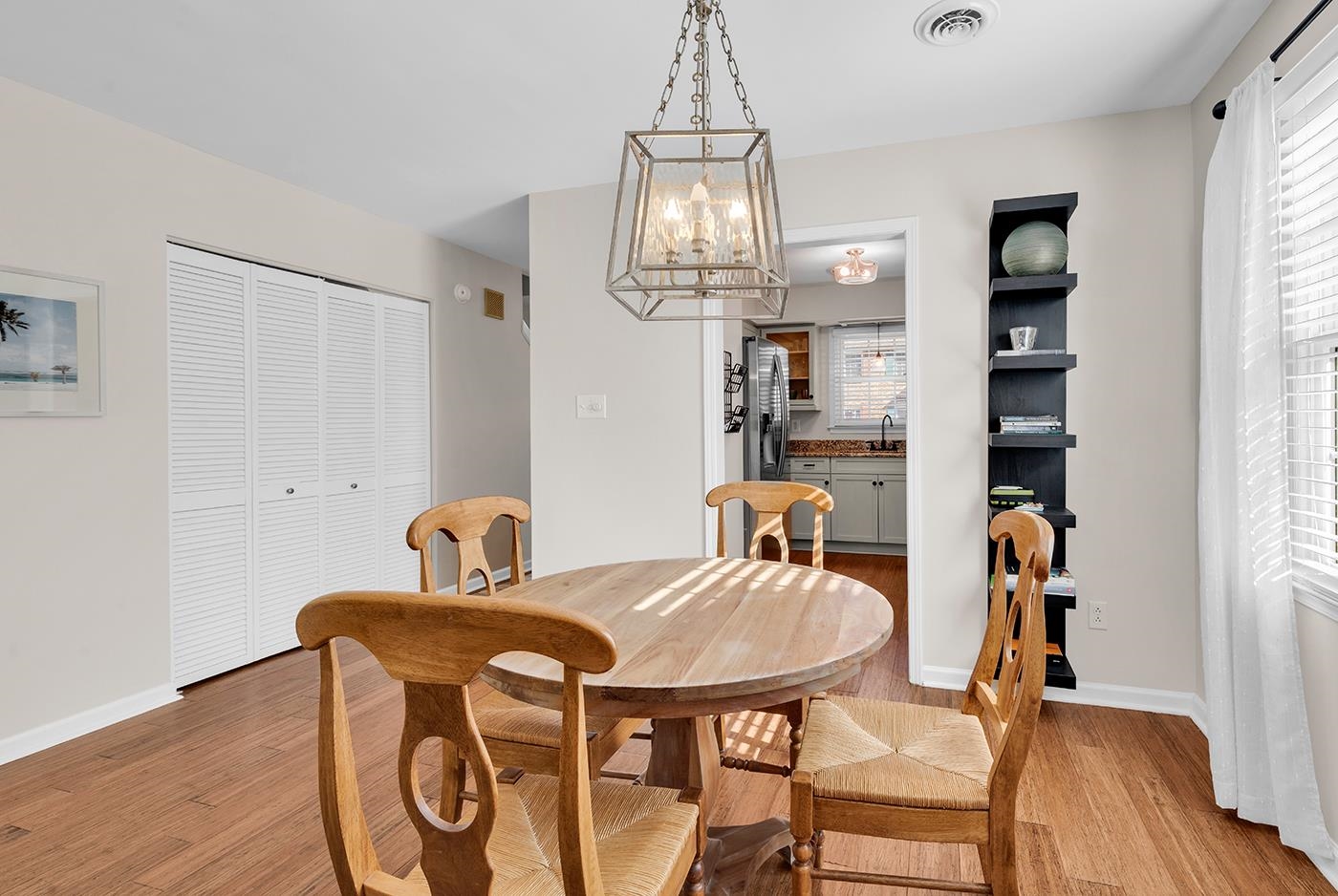 830 44th Avenue North, Unit L1 Myrtle Beach, SC 29577 - Photo 14 of 40 Dining space with light wood-type flooring and a chandelier