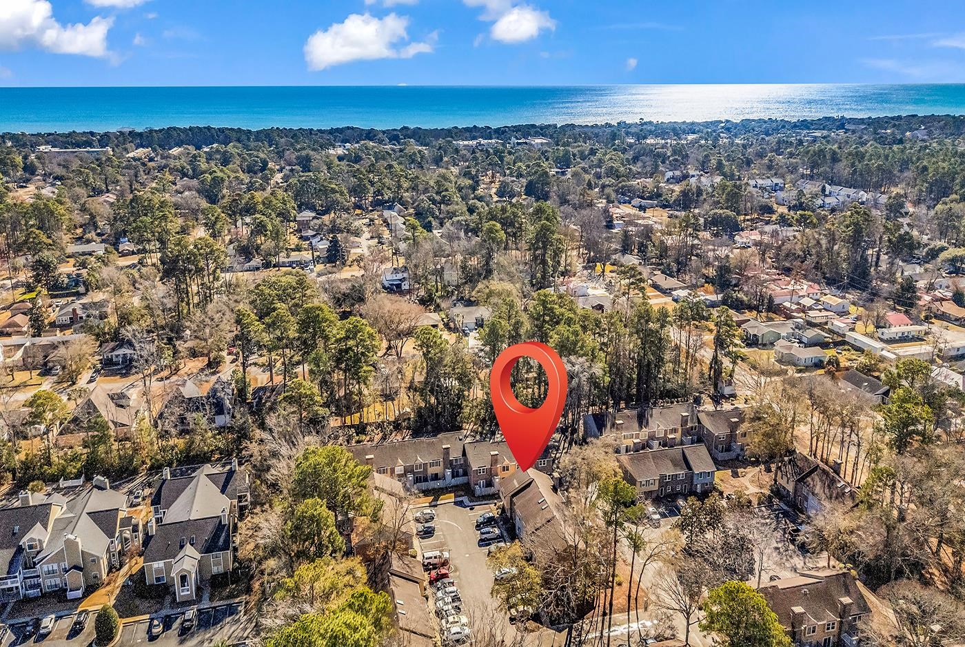 830 44th Avenue North, Unit L1 Myrtle Beach, SC 29577 - Photo 2 of 40 Aerial view of property and surrounding area featuring nearby suburban area and a nearby body of water