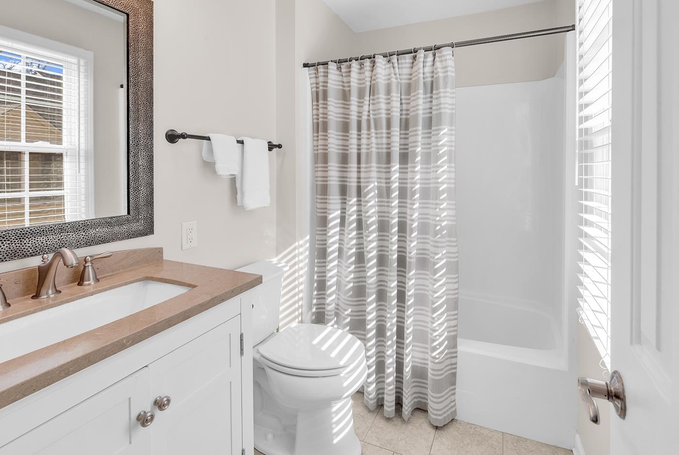 830 44th Avenue North, Unit L1 Myrtle Beach, SC 29577 - Photo 30 of 40 Bathroom featuring vanity, shower / tub combo, and light tile patterned flooring