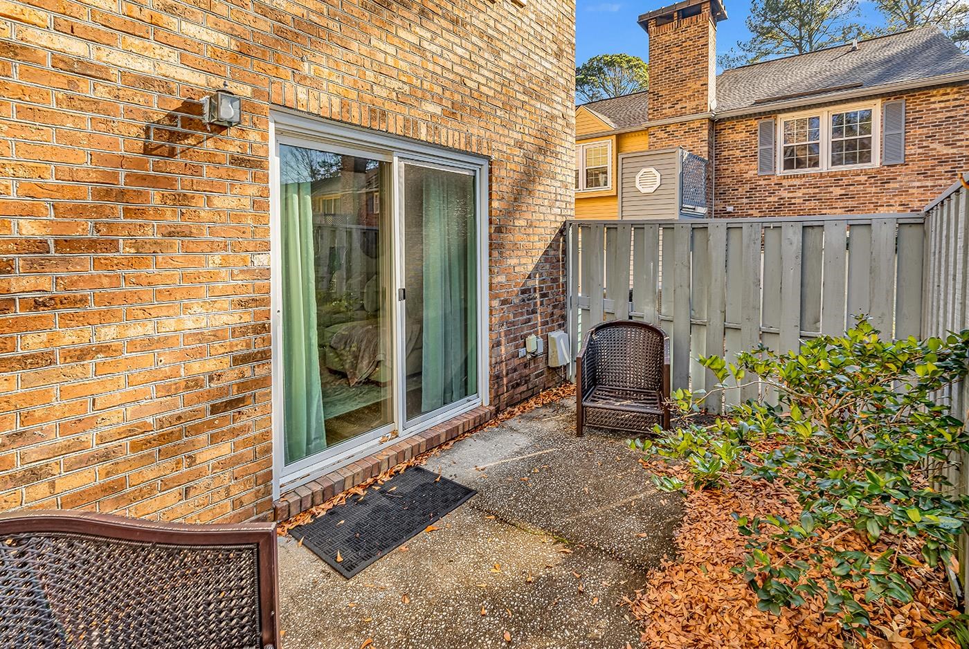 830 44th Avenue North, Unit L1 Myrtle Beach, SC 29577 - Photo 31 of 40 Entrance to property featuring brick siding, a chimney, and a patio area