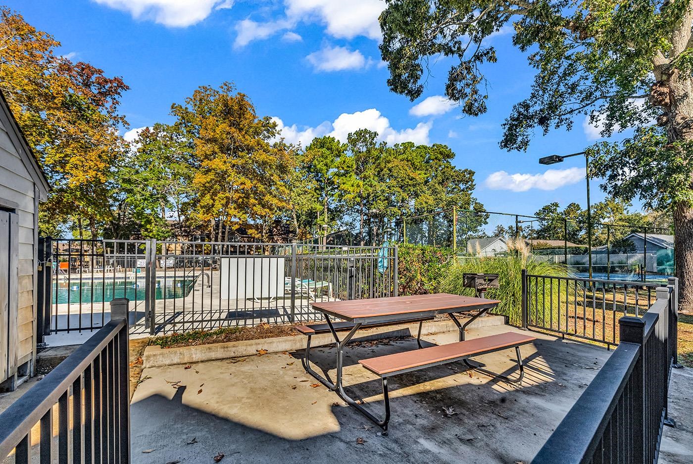 830 44th Avenue North, Unit L1 Myrtle Beach, SC 29577 - Photo 39 of 40 Wooden terrace with a patio and outdoor dining space