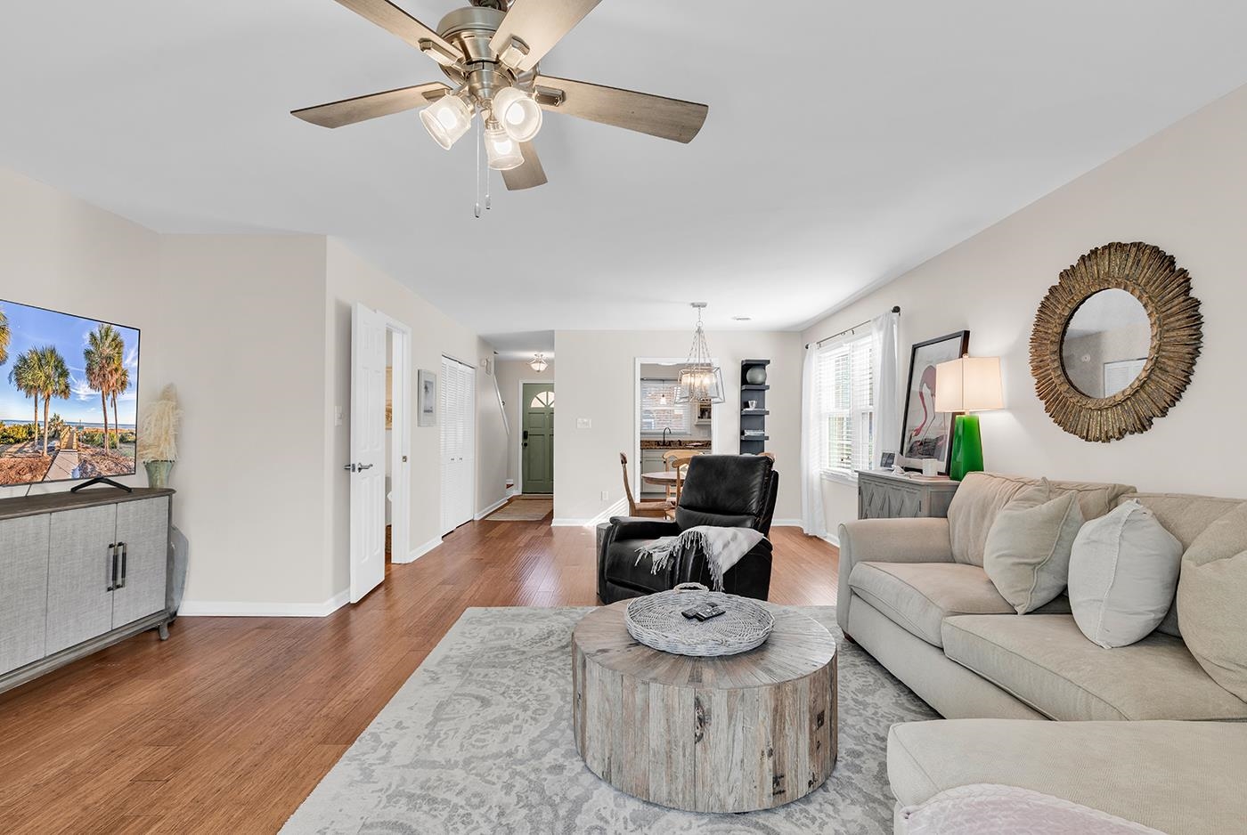 830 44th Avenue North, Unit L1 Myrtle Beach, SC 29577 - Photo 7 of 40 Living room with wood finished floors, ceiling fan, and a chandelier