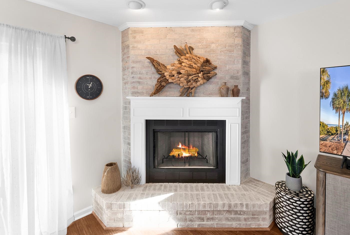 830 44th Avenue North, Unit L1 Myrtle Beach, SC 29577 - Photo 8 of 40 Detailed view of a fireplace and wood finished floors