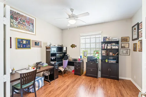 a workspace with furniture and wooden floor