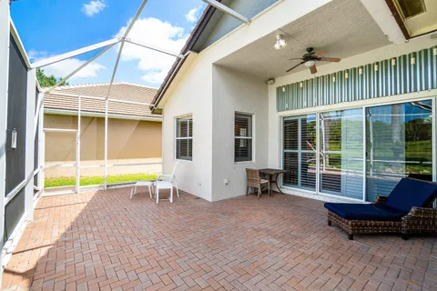 a building outdoor space with patio area and glass windows