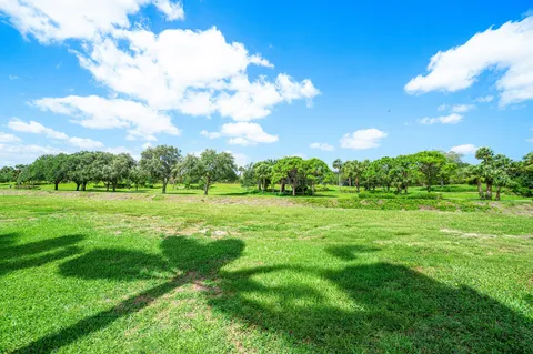 a view of a green field with clear sky
