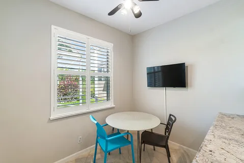 a view of a livingroom with furniture and a window
