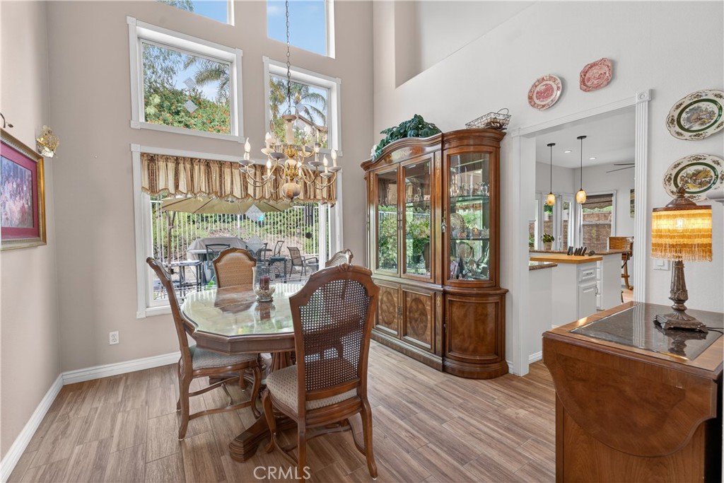 17 Vía Anadeja Rancho Santa Margarita, CA 92688 - Photo 12 of 43 a view of a dining room with furniture window and wooden floor