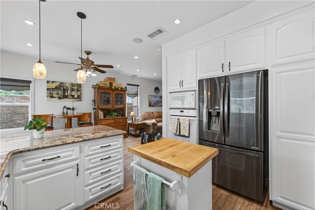 17 Vía Anadeja Rancho Santa Margarita, CA 92688 - Photo 13 of 43 a kitchen with refrigerator and cabinets
