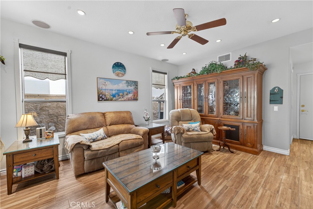 17 Vía Anadeja Rancho Santa Margarita, CA 92688 - Photo 17 of 43 a living room with furniture a wooden floor and a window
