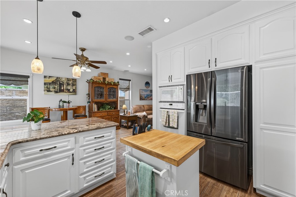 17 Vía Anadeja Rancho Santa Margarita, CA 92688 - Photo 21 of 43 a kitchen with refrigerator and cabinets