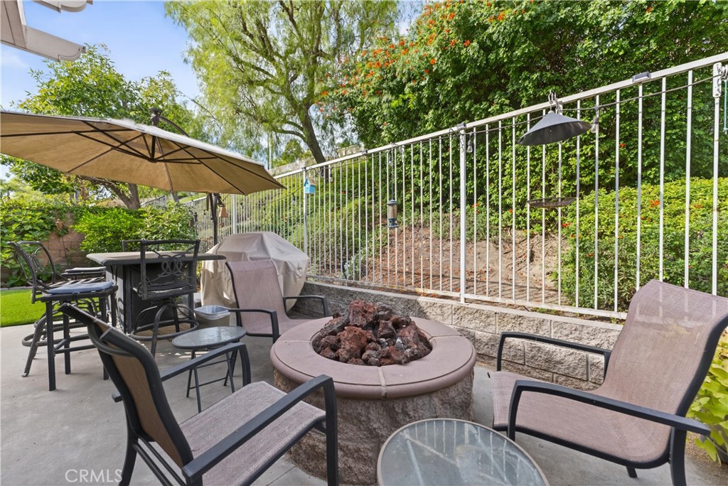 17 Vía Anadeja Rancho Santa Margarita, CA 92688 - Photo 29 of 43 a view of a chairs and table in the back yard
