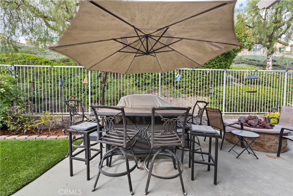 17 Vía Anadeja Rancho Santa Margarita, CA 92688 - Photo 30 of 43 a table and chairs in the garden