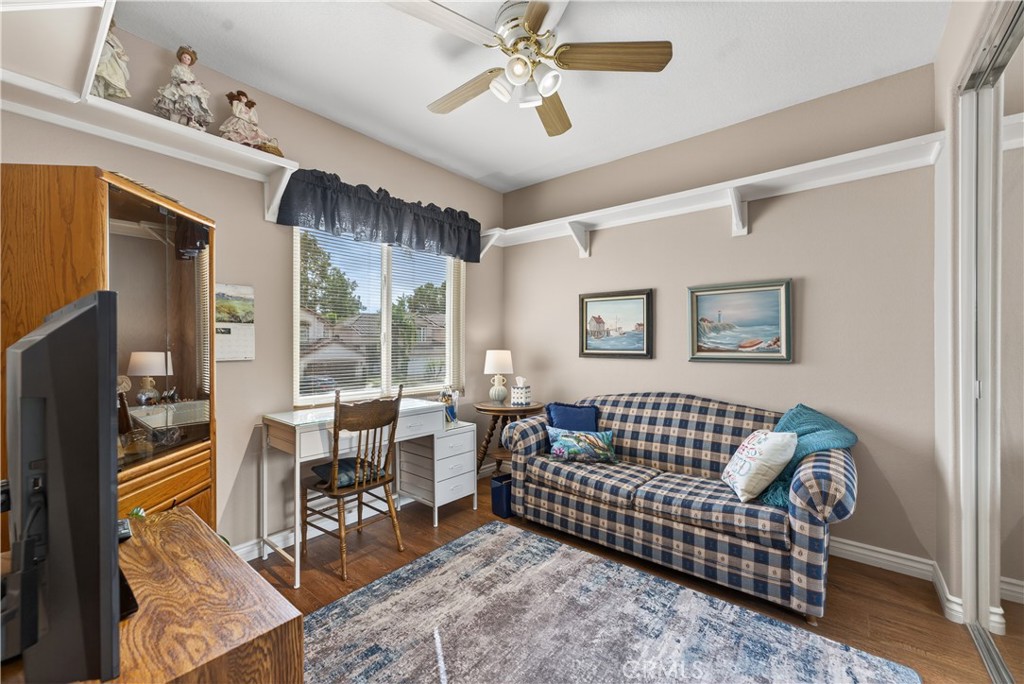 17 Vía Anadeja Rancho Santa Margarita, CA 92688 - Photo 39 of 43 a living room with furniture and a flat screen tv