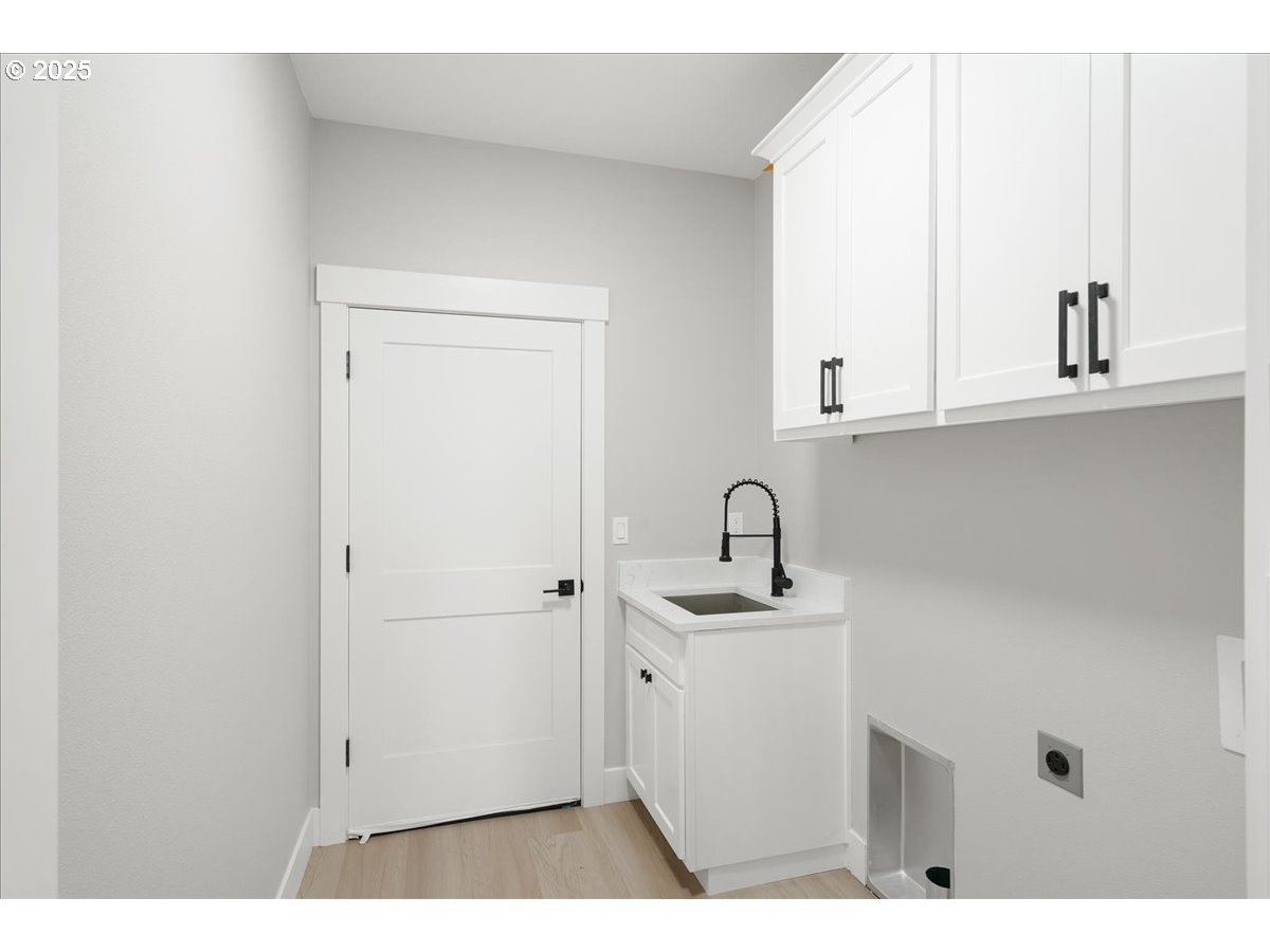 628 Parker Loop Silverton, OR 97381 - Photo 13 of 19 a kitchen with a sink cabinets and a window