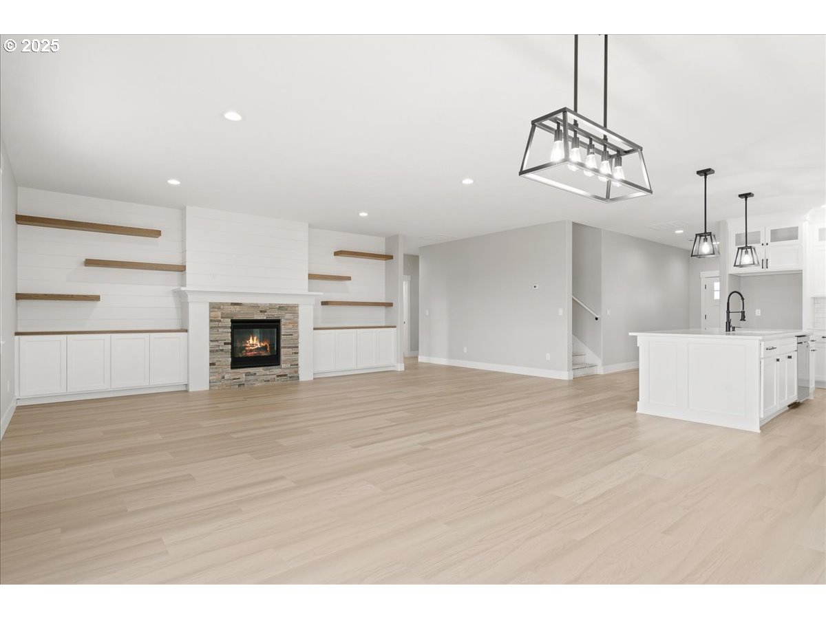 628 Parker Loop Silverton, OR 97381 - Photo 2 of 19 a view of a kitchen with a sink and dishwasher wooden floor