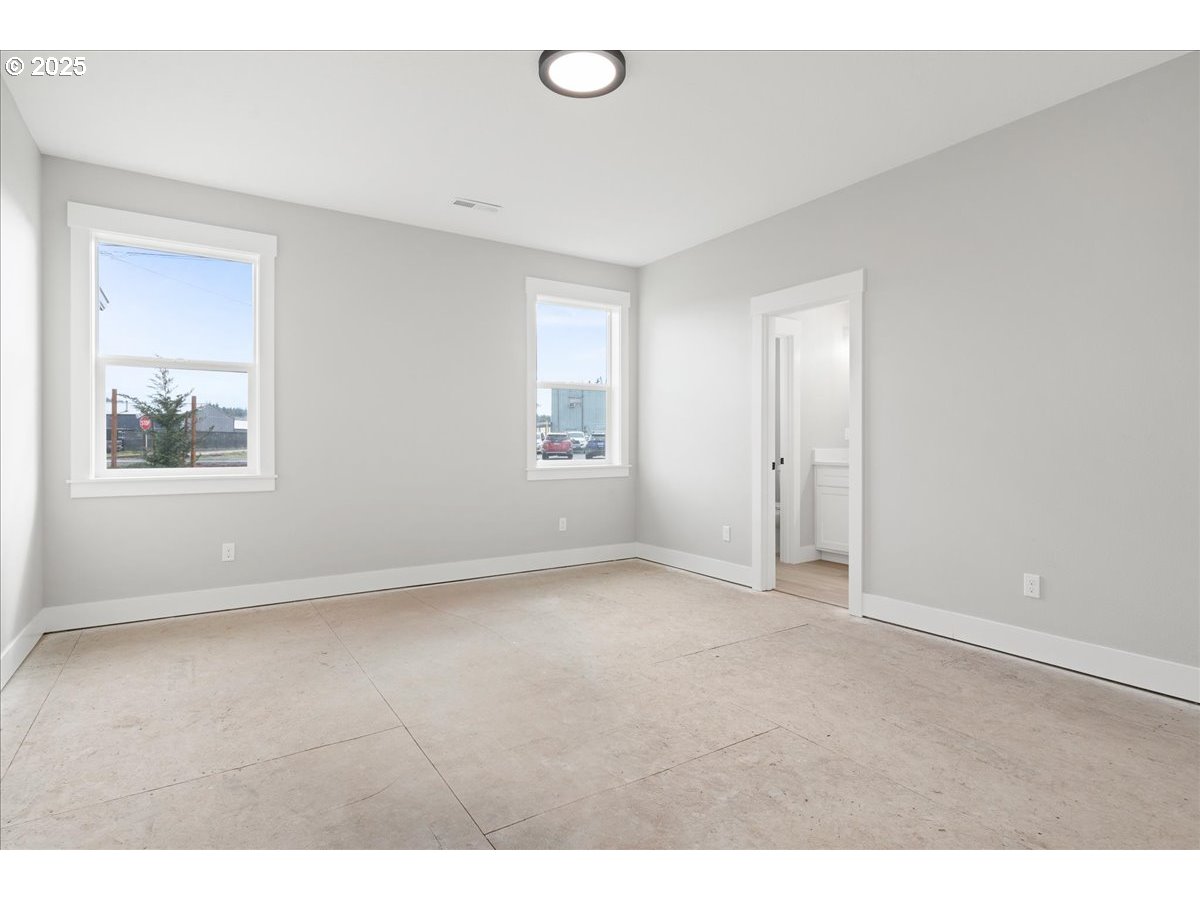 628 Parker Loop Silverton, OR 97381 - Photo 6 of 19 a view of an empty room with a window