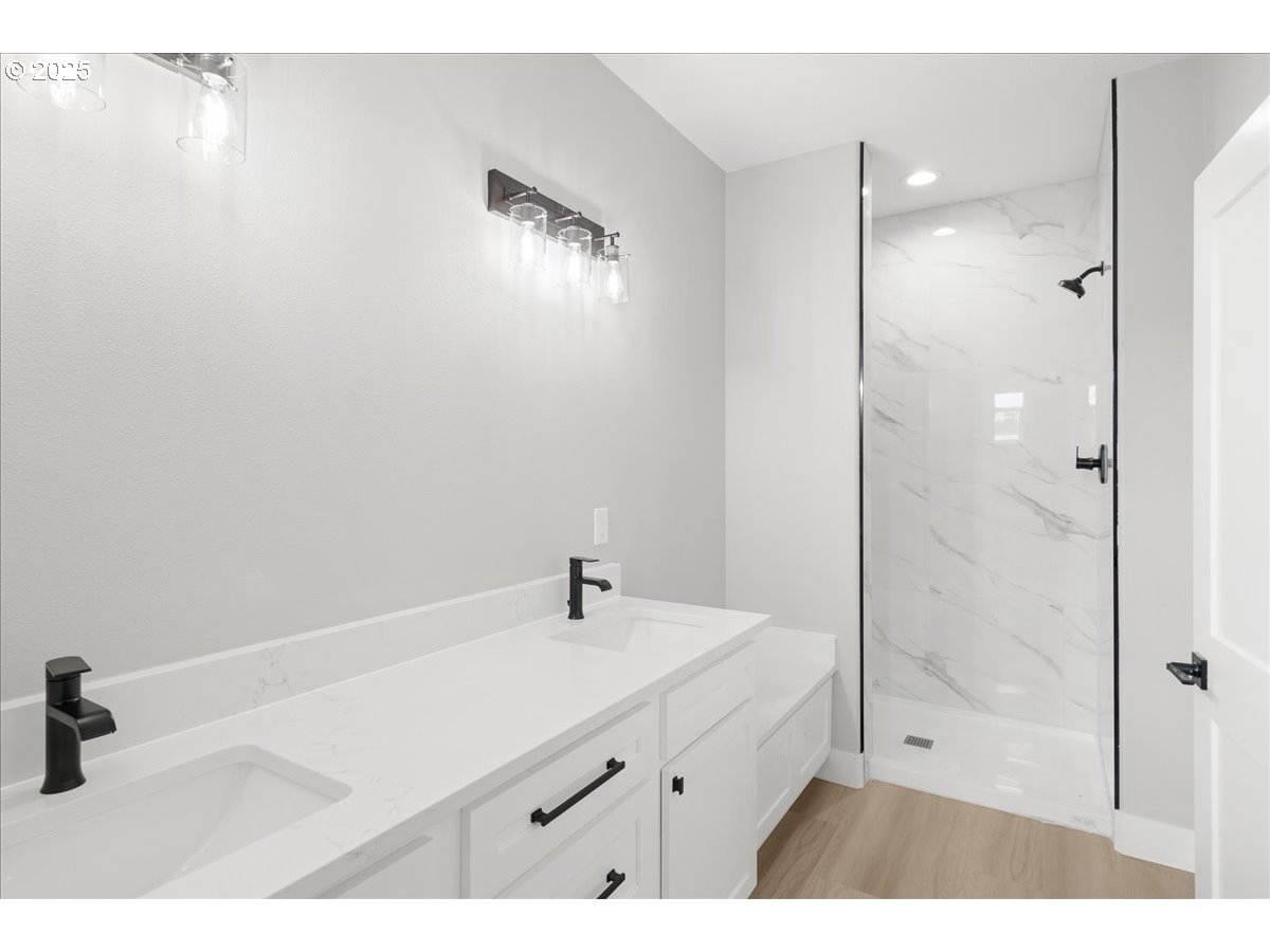 628 Parker Loop Silverton, OR 97381 - Photo 7 of 19 a bathroom with a sink and a mirror