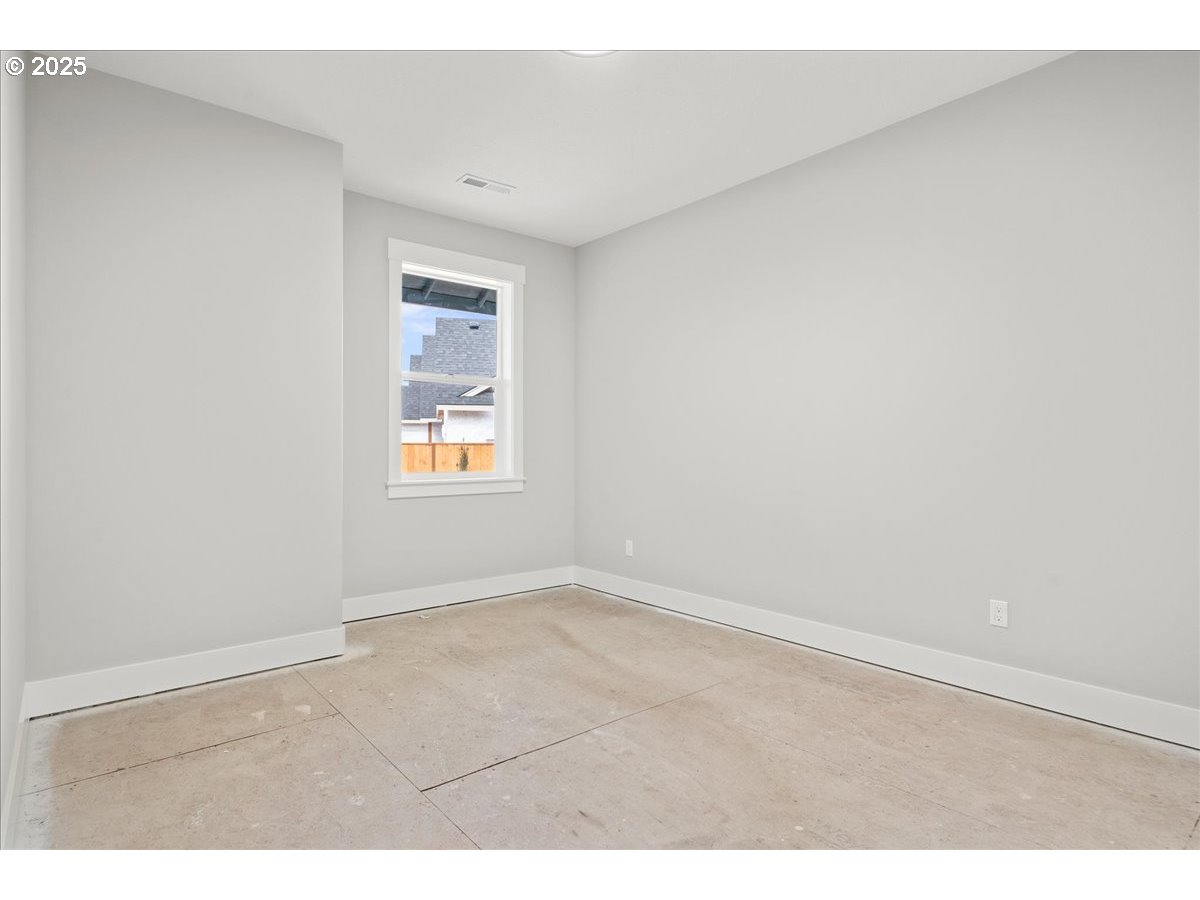 628 Parker Loop Silverton, OR 97381 - Photo 10 of 19 an empty room with windows