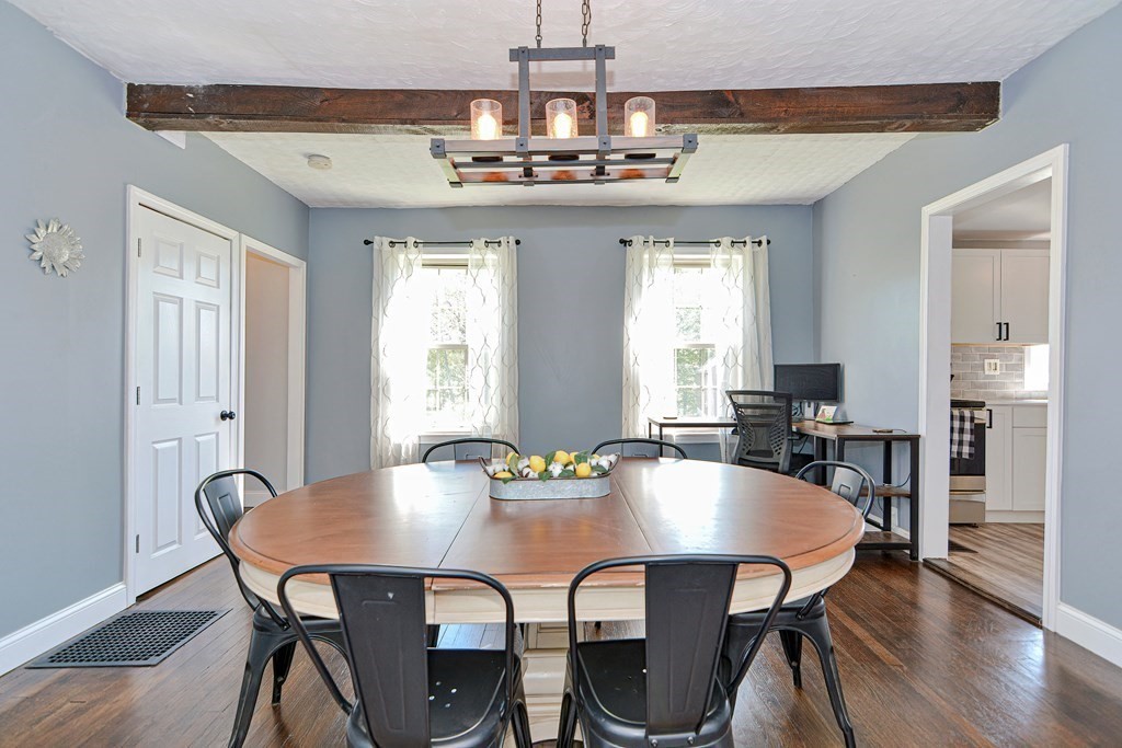 122 Mendon Road Sutton, MA 01590 - Photo 11 of 36 a view of a dining room with furniture wooden floor and chandelier
