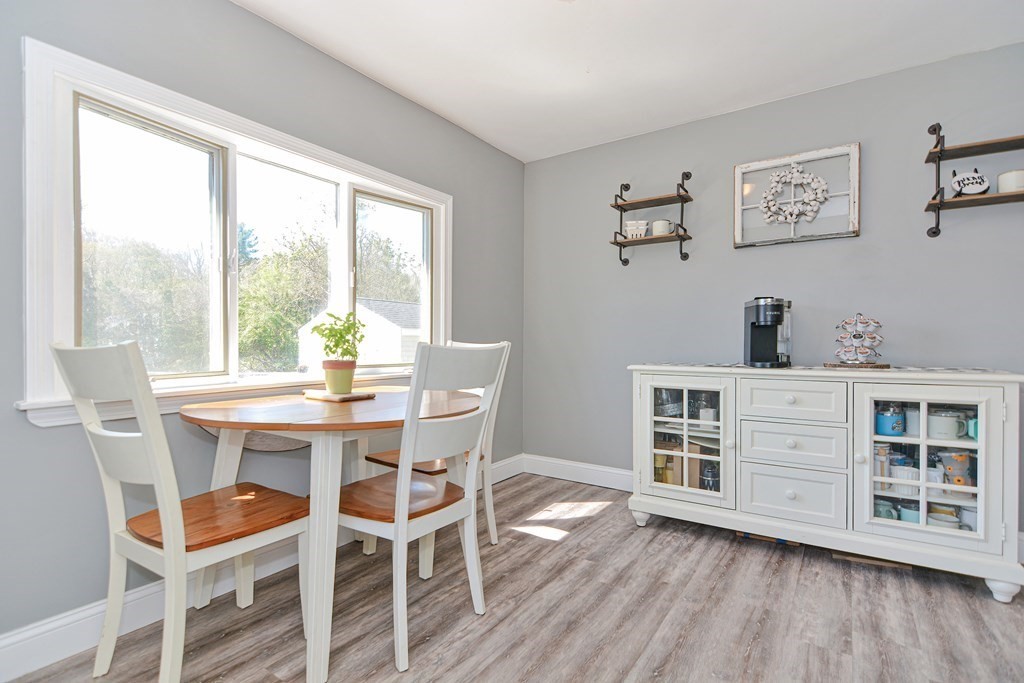 122 Mendon Road Sutton, MA 01590 - Photo 15 of 36 a view of a dining room with a table and chairs