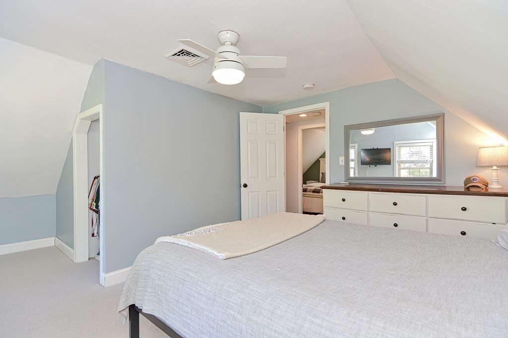 122 Mendon Road Sutton, MA 01590 - Photo 20 of 36 a bedroom with a bed and a dresser
